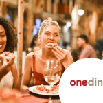 Woman eating at table with friends